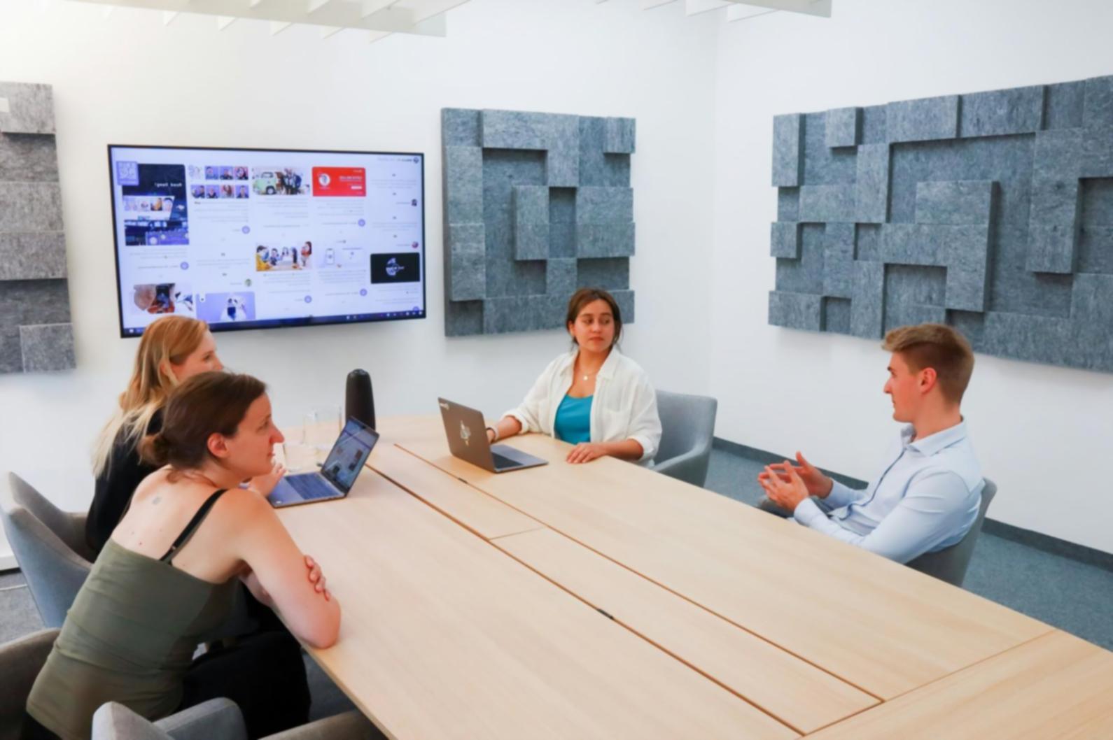 Sales professionals collaborating and sharing best practices